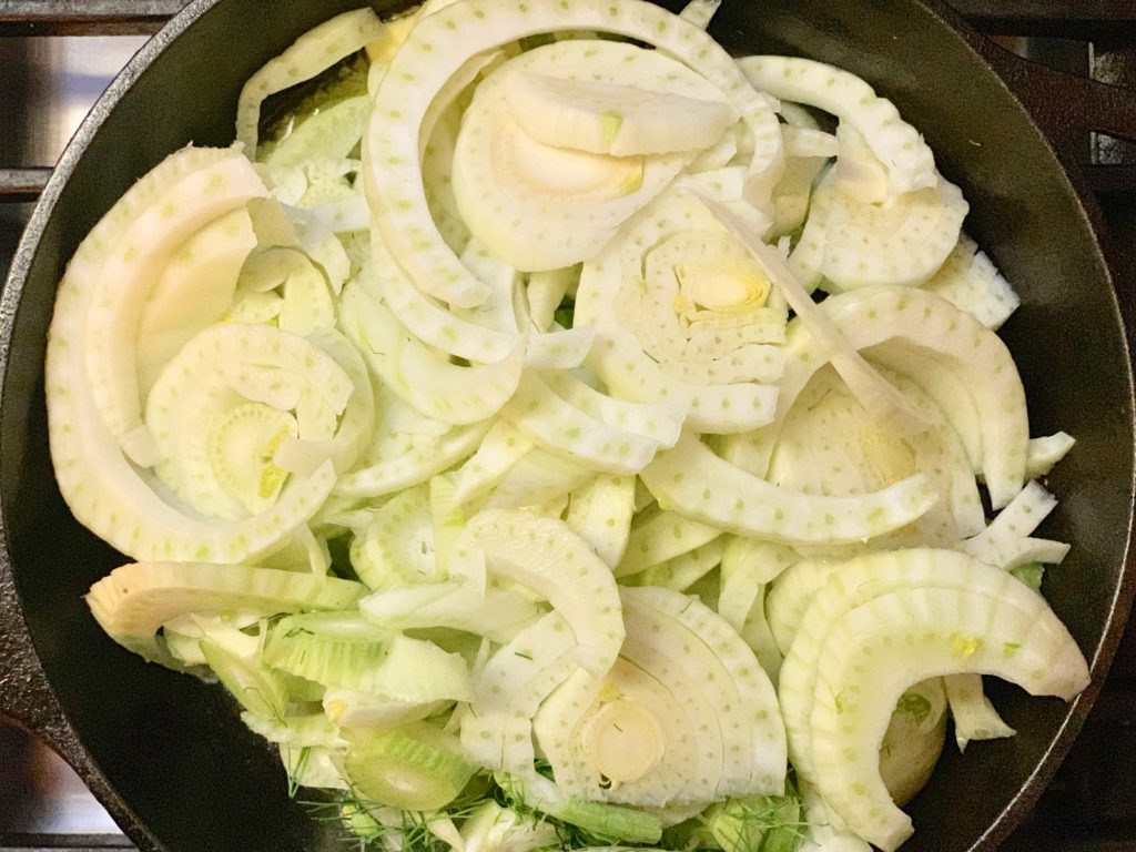 sliced fennel in cast-iron skillet