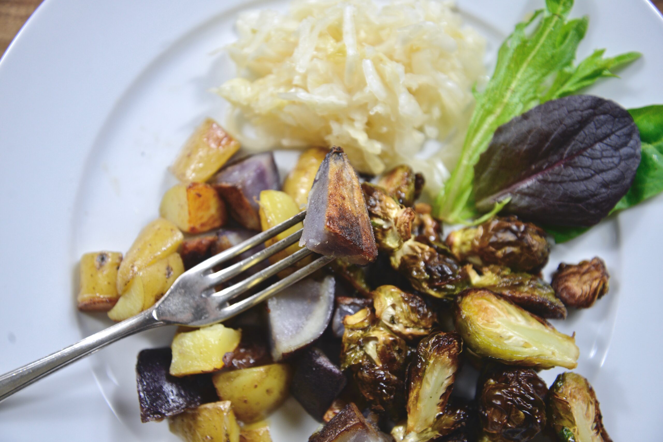camel hump fat fried skillet potatoes and roasted brussel sprouts