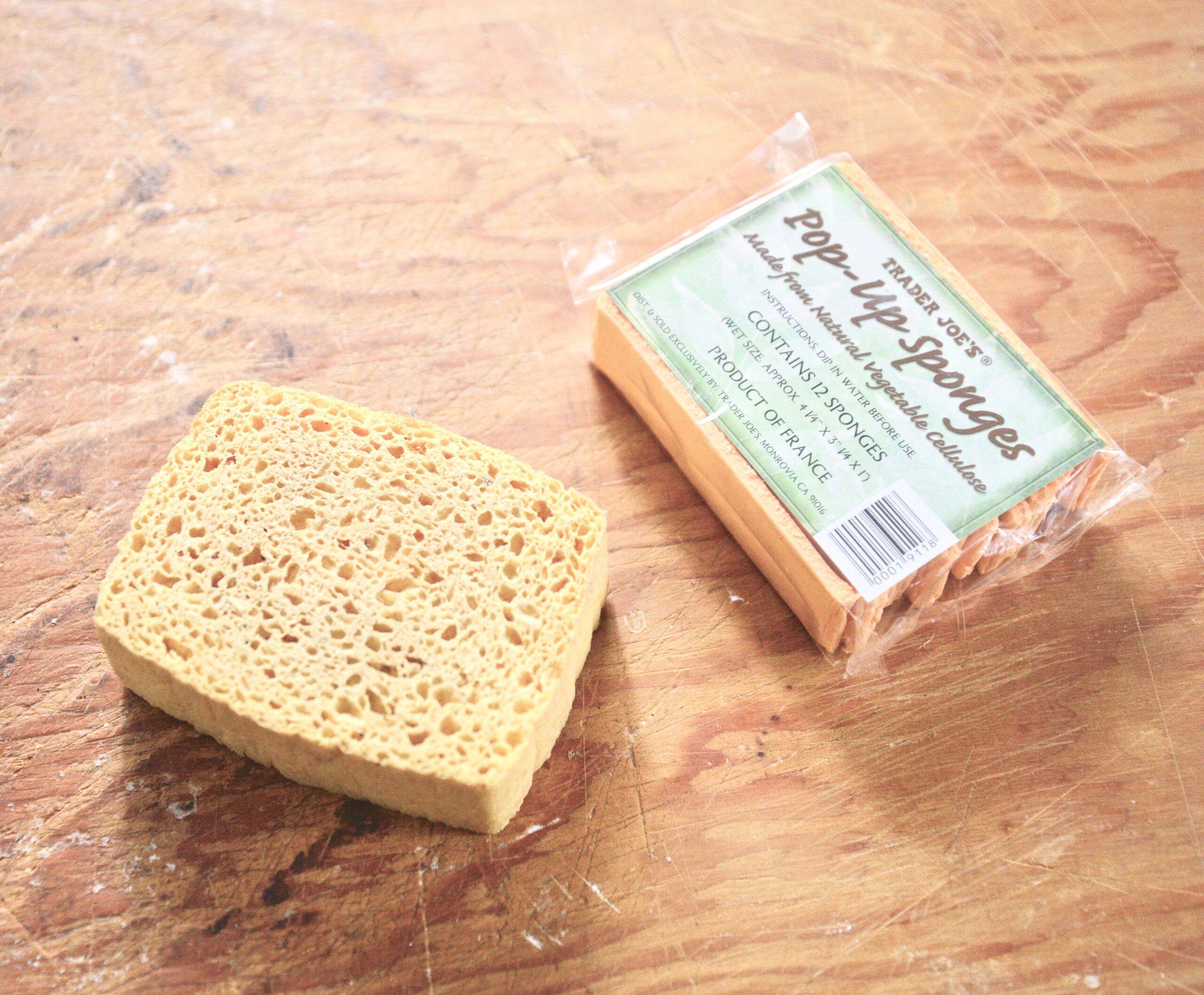 cellulose sponge next to a package of Trader Joe's pop-up sponges