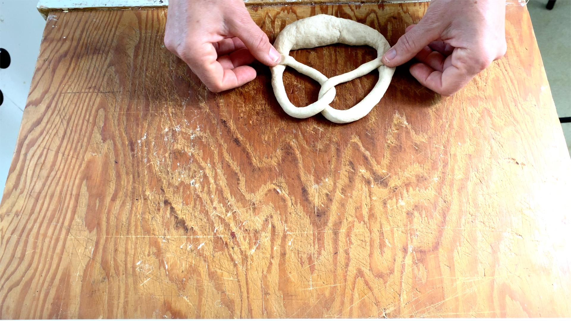 forming German pretzel