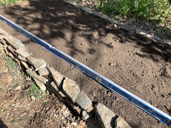leveling soil in garden bed