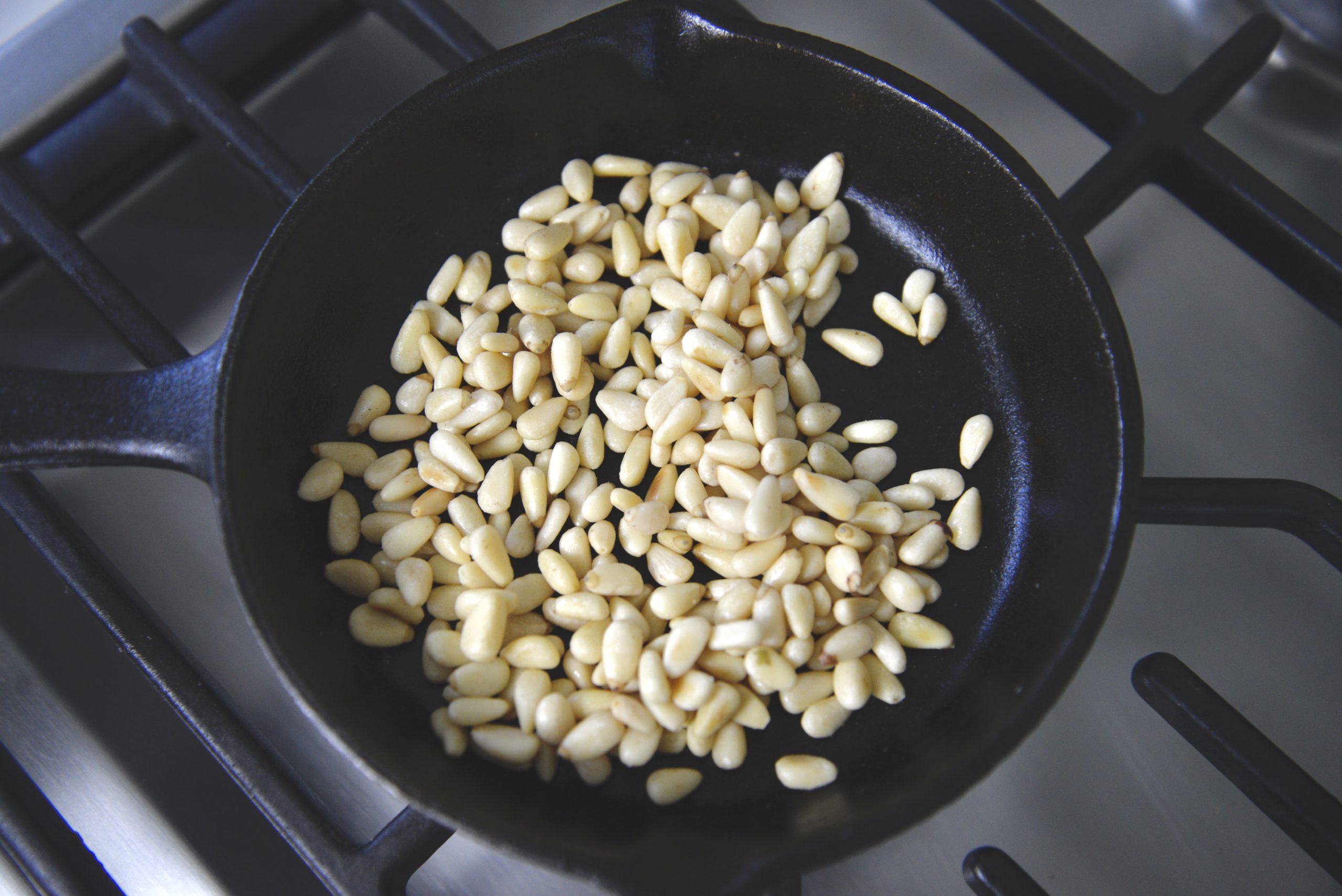 pine nuts roasted in cast iron skillet
