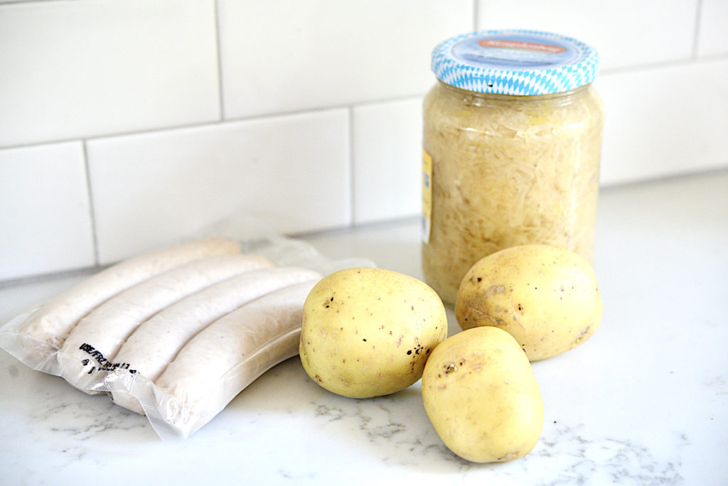 German white sausages, sauerkraut, and potatoes