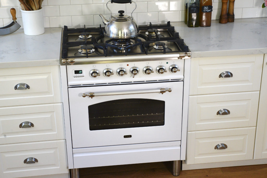 white Ilve gas stove in white kitchen