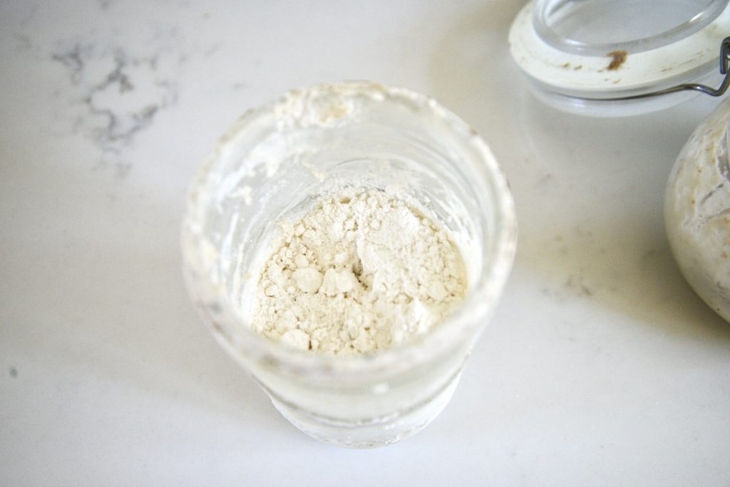 flour on top of sourdough starter