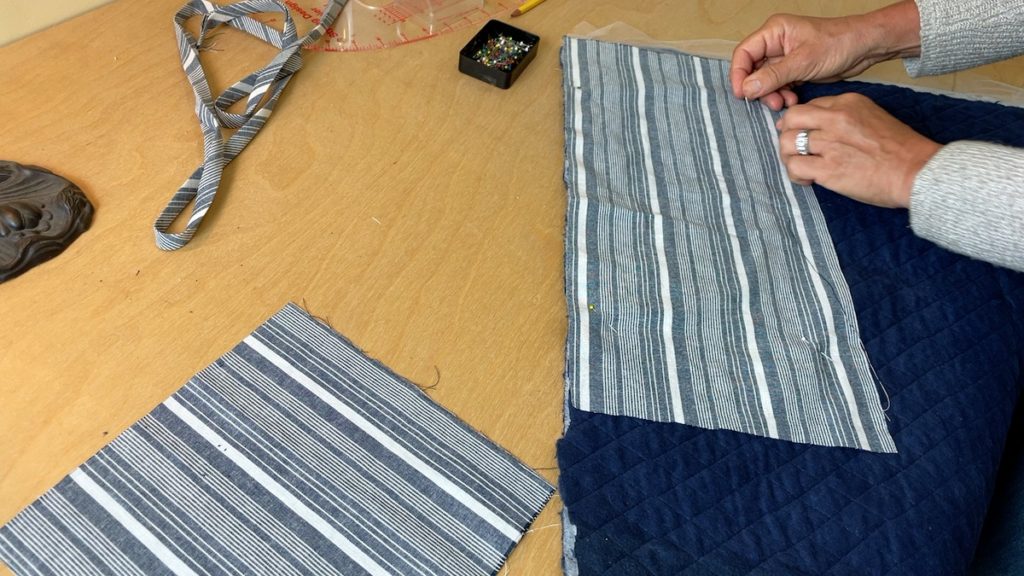 cutting the fabric for the potholders and the batting