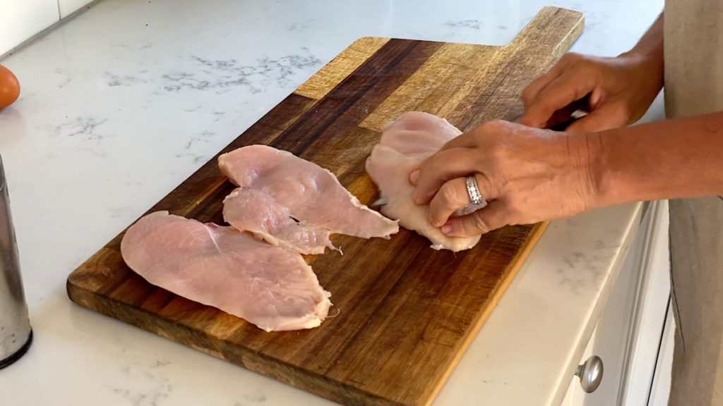 cutting chicken breasts in half